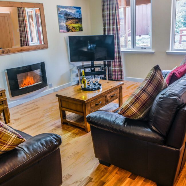 Spacious living area with Smart TV home cinema system at Birchbrae Highland Lodges, nr Glencoe & Fort William.